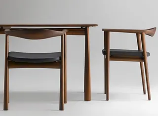 Wooden dining table with two matching armchairs