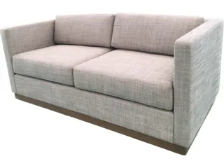 Light gray upholstered three-seat sofa with wooden base