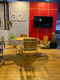 Furniture display with wooden chairs and table in an exhibition space
