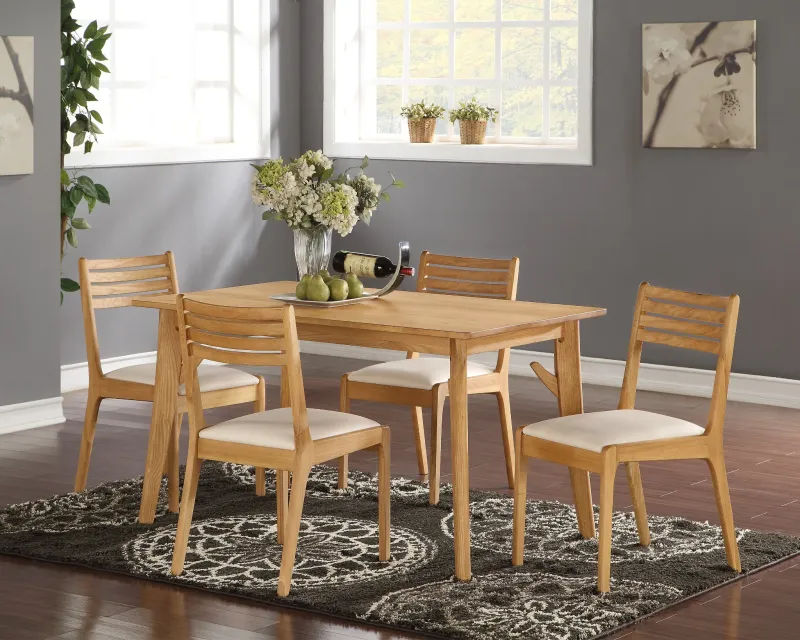 Wooden dining table with four ladder-back chairs and upholstered seats