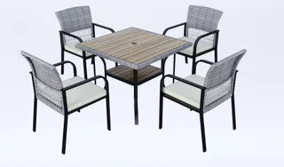 Woven outdoor dining table with four armchairs