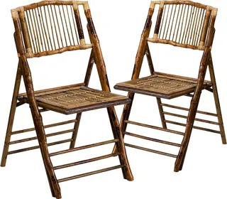 Pair of dark bamboo folding chairs on a white background.