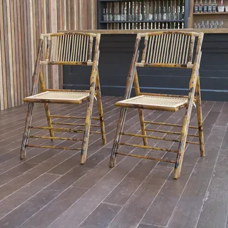 Two finished bamboo folding chairs displayed in a showroom.