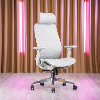 White ergonomic office chair photographed against curtains with pink lighting
