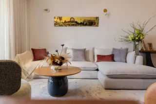 Contemporary sectional sofa and coffee table arranged in a bright living room