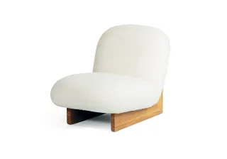 White upholstered lounge chair with a wooden base