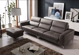 Gray leather sectional sofa with matching ottoman