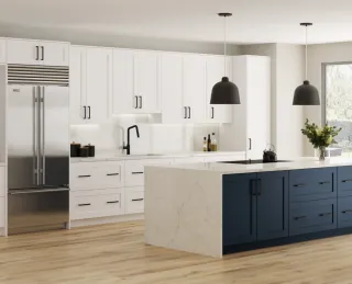 White and navy kitchen cabinetry with island, refrigerator and pendant lights