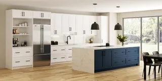 White and navy kitchen cabinets with island, marble countertop and pendant lights