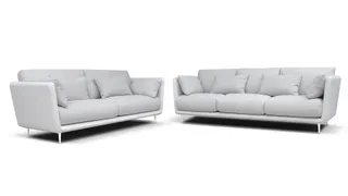 Two white upholstered sofas on a white background