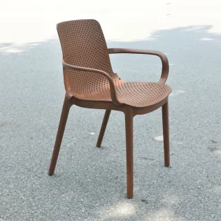 Brown perforated armchair photographed outdoors