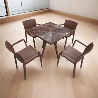 Brown square dining table and four chairs indoors