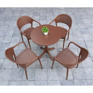Brown round table and four matching perforated chairs