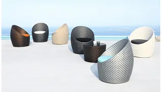 Collection of curved woven lounge chairs in black, white and gray
