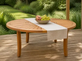 Round slatted wooden outdoor table with fruit bowl and table runner