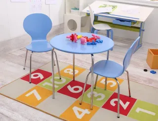 Blue children's table and chairs on a colorful numbered rug