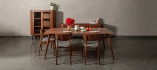 Rectangular wood dining table with chairs and glass-front cabinet