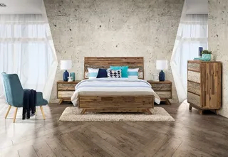 Bedroom with wood bed, bedside tables, dresser and tall cabinet