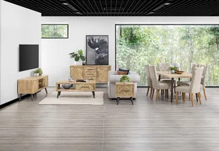 Living and dining room with wood cabinets, tables and upholstered seating