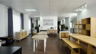 Furniture showroom displaying tables, cabinets, benches and shelving.