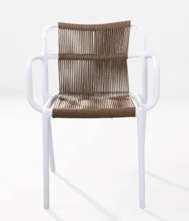 White armchair with a tan woven seat and backrest indoors