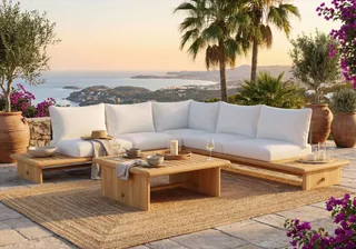 Outdoor wooden coffee table and white sectional sofa on a tiled terrace