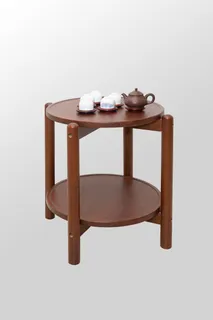 Round two-tier wooden serving table with teaware
