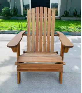 Wooden Adirondack-style lounge chair outdoors.