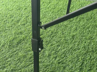 Close-up of folding table leg joint and locking mechanism