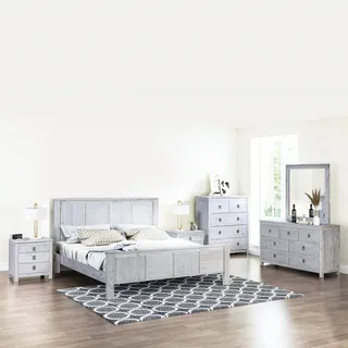 Light gray bedroom furniture collection with bed, dressers, nightstands, and rug