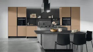 Taupe kitchen cabinets with black worktops and central island