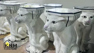 White ceramic cat-shaped side tables with round tops