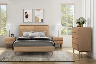 Wood bed, bedside tables and tall dresser in a bright bedroom