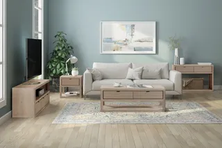 Wood TV unit, side table and coffee table with a sofa in a living room