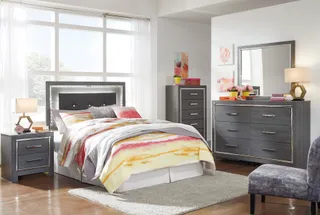 Dark bedroom furniture set with bed, nightstands, dresser, and mirror