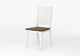 Angled view of a white wooden dining chair with a dark wood seat