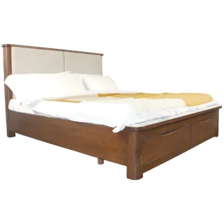 Wooden bed with an upholstered headboard and white bedding