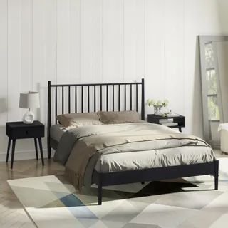 Black wooden bed with vertical spindle headboard and bedside table.