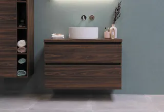 Dark wood wall-mounted bathroom vanity with vessel sink and storage cabinet