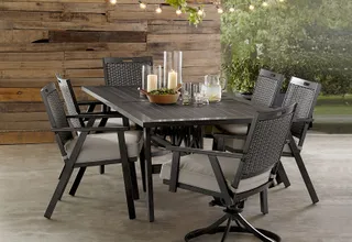 Woven outdoor dining set with table and six chairs