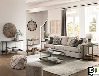 Living room with sofa, metal-frame coffee table, console and side tables.