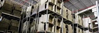 Warehouse racks stacked with finished wicker furniture