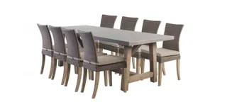 Large outdoor dining table with six woven chairs