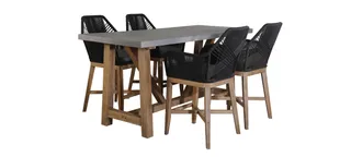 Outdoor dining table with four black woven chairs
