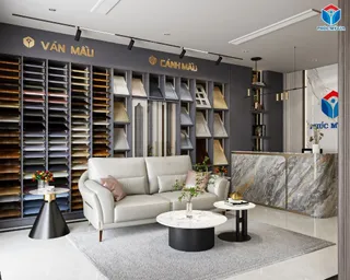Furniture materials showroom with sample racks, sofa, coffee tables and reception desk