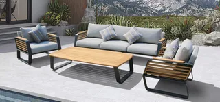 Outdoor gray sofa and armchairs with striped cushions around a wooden coffee table.