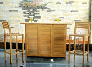 Wooden louvered bar cabinet with two matching bar chairs indoors
