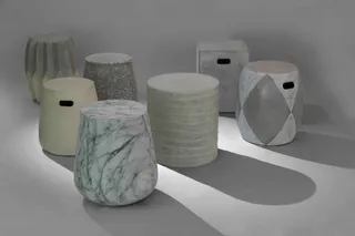 Collection of sculptural stools in marble, concrete, wood and painted finishes.