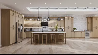 Spacious beige kitchen with central island and extensive wall cabinetry