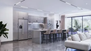 Modern gray kitchen with island, bar stools and stainless appliances